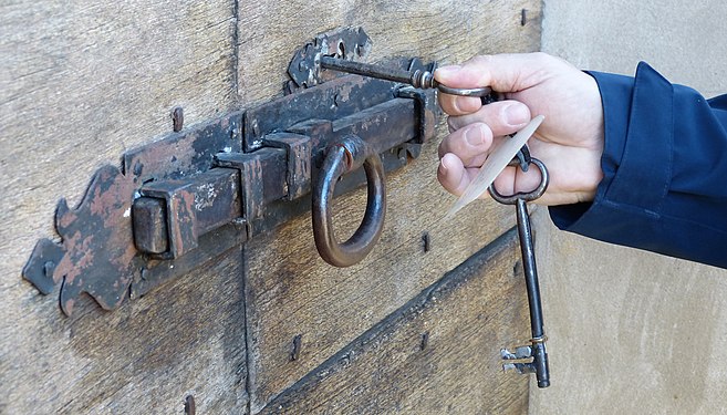 An old lock with key at a chapel in the Blenio Valley, Switzerland