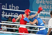 Deutsch: Boxen bei den Olympischen Jugendspielen 2018 Tag 12, 18. Oktober 2018 - Kampf um Bronze im Leichten Weltergewicht Jungen – Hassan Azim (Großbritannien, rot) schlägt Mohammed Boulaouja (Marokko, blau) RSC; Ringrichter ist Wulfren Olivares Peréz (Kolumbien). English: Boxing at the 2018 Summer Youth Olympics on 18 October 2018 – Bronze Medail Match Light Welterweight Boys - Hassan Azim (Great Britain, red) beats Mohammed Boulaouja (Morocco, blue) RSC; Referee is Wulfren Olivares Peréz (Columbia). Español: Boxeo en los Juegos Olímpicos Juveniles de Verano de 2018 en 18 de octubre de 2018 - Medalla de bronce de los hombres ligeros de peso welter: Hassan Azim (Gran Bretaña, rojo) vence a Mohammed Boulaouja (Marruecos, azul) RSC; El árbitro es Wulfren Olivares Peréz (Colombia).