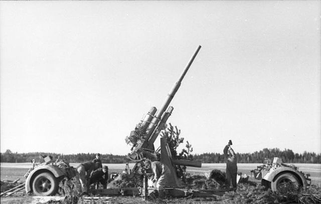 8.8cm Flak 36 being emplaced, with both bogies already detached