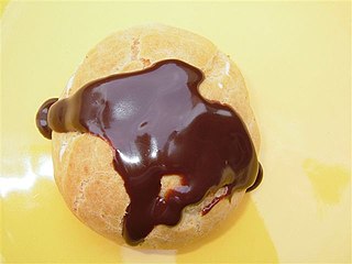 A profiterole with chocolate.