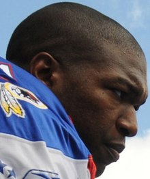 An American football player wearing a blue jersey.