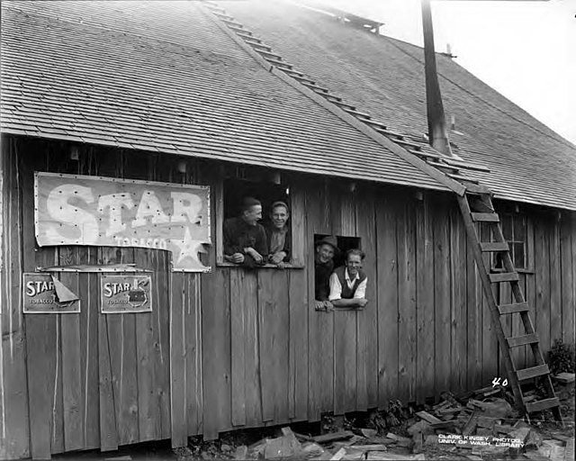 Crew looking out of camp building windows, Brookings Timber and Lumber Company, Brookings, ca. 1919