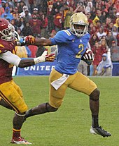 Fuller with UCLA in 2012 Devin Fuller against Dion Bailey (cropped).jpg