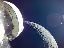 Orion capsule of Artemis 1 above the Moon in December 2022. Earth rising behind the Moon.jpg