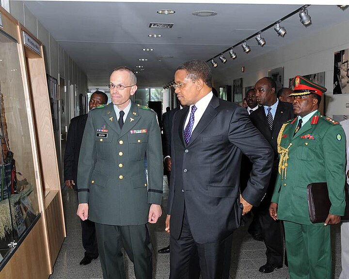 Dr. Jakaya Kikwete, president of Tanzania, with his aide-de-camp (right) in 2009