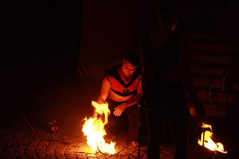File:Fireshow man lighting fire in Třebíč at Zámostí 2014 in Třebíč, Třebíč District.jpg