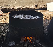 Smoking of fish over an open fire in Ghana, 2018 Fish smoking in Ghana.jpg