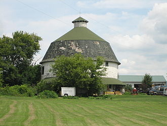 The Bruce Round Barn features a single hip roof and a wooden central silo. Freeport Il Bruce Round Barn5.JPG