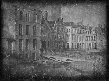 ‘View of the Predikherenlei and Predikherenbrug’ depicts the first photographic record of Ghent and in all probability Belgium. It dates back to October 1839, when optician François Braga arrived in Ghent with the daguerreotype camera. Together with his friend, seller of prints and engravings Joseph Pelizzaro, he took the picture on the second floor of judge Philippe Van de Velde’s residence on the Ajuinlei. Of the four original plates they made, two plates are in the holdings of STAM – Ghent City Museum, while the two others are lost.