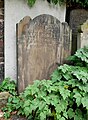 Gravestones along the churchyard wall around the Church of Saint George in Gravesend.