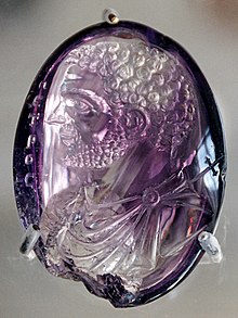 Amethyst intaglio of Caracalla, later re-carved as Saint Peter inscribed with the Greek: O PETRO[?]
, translit. o Petros, lit. "the stone" (treasury of Sainte-Chapelle) Intaglio Caracalla Cdm Paris Chab2101.jpg