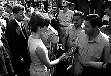 John F. Kennedy and Jackie Kennedy greet members of the Brigade at the Miami Orange Bowl JFK Brigade 2506 meeting.jpg