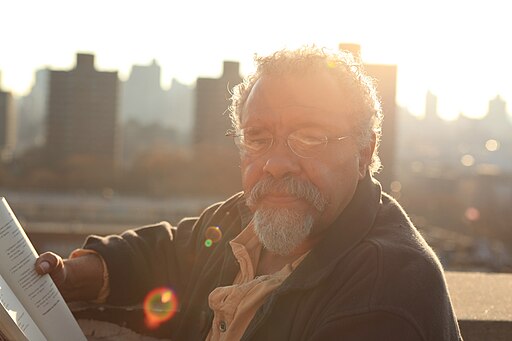 Jesus Papoleto Melendez reading from his book on his roof in East Harlem