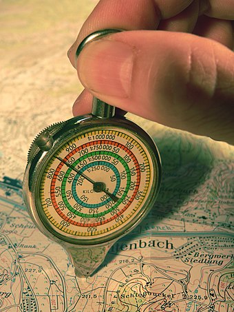 Curvimeter used to measure a distance on a topographic map