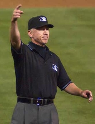 Baseball umpire Lance Barksdale signalling an ejection