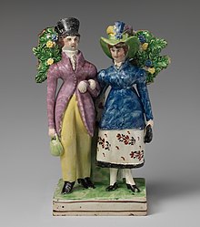 Genteel couple, 1825-30, a type known as "Dandy and Dandizette". Such genre figures were now much less common. Man and woman standing near a tree MET DP-1372-002 (cropped).jpg