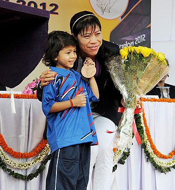 Olympics Bronze medalist Mary Kom with young sportsperson.
