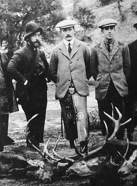 Prince Arthur of Connaught wearing traditional Spanish hunting chaps or zahones at a montería in El Pardo, 1908. Alfonso XIII and the Duke of San Pedro de Galatino to his left and right respectively
