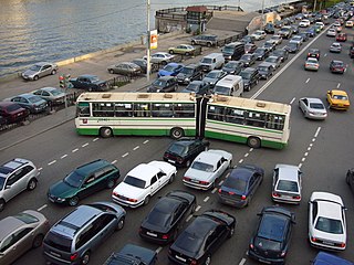 Traffic congestion condition on road networks that occurs as use increases, and is characterized by slower speeds, longer trip times, and increased vehicular queueing