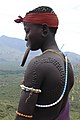 Mursi woman with lip plate and decorative scars