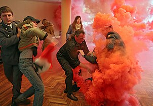 Smoke from a smoke bomb disrupts a polling station during a 2007 election in Russia