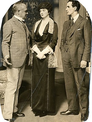 Nat Goodwin, an unidentified actress, and Leonard Mudie in the play in 1918 Nat Goodwin and Leonard Mudie in "Why Marry" (SAYRE 13147).jpg