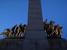 The memorial viewed from the west; the figures emerge through the arch from war to peace[1] or in the Great Response of Canada to a call to war[11][15]