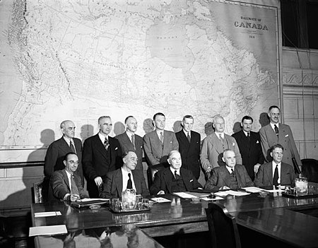 St. Laurent (bottom, centre-right) and King (bottom, centre) and other delegates negotiating the entry of Newfoundland and Labrador into Confederation, 1947