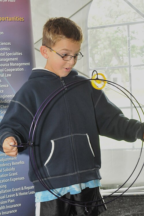 A student examines Argonne's Gyro Wheel at the Open House.