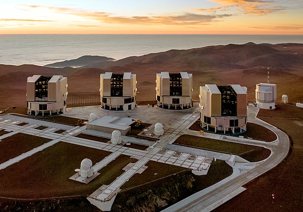 The four Unit Telescopes that form the VLT together with the four Auxiliary Telescopes (VST at right)