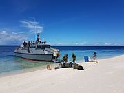 A Marine commando unit exhibits troop extraction from an indigenously-built Multipurpose Assault Craft