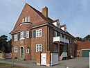 Post building with residential building for officials, stable building, wagon shed, street-side property fence and courtyard paving