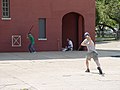 Image 41Stickball is a common street variant of baseball which often features impromptu adaptations. (Note the painted strike zone on the wall behind the batter.) (from Baseball)