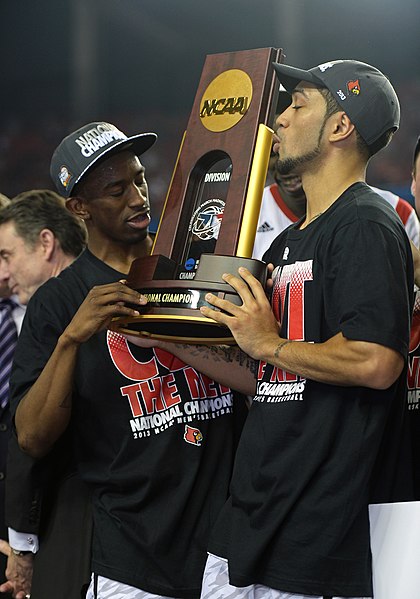 Russ Smith (left) and Siva (right) with the 2013 NCAA Division I men's basketball tournament trophy.