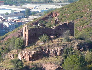 Sant Genís de Rocafort visto desde la sierra de l'Ataix, con Martorell al fondo.