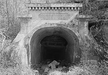 Historic American Engineering Record photo of the entrance portal to Sloss No. 2 in 1993. This particular mine was opened in 1890 and had reached a depth of 1,330 feet (410 m) by 1908. Sloss No. 2 mine portal.jpg