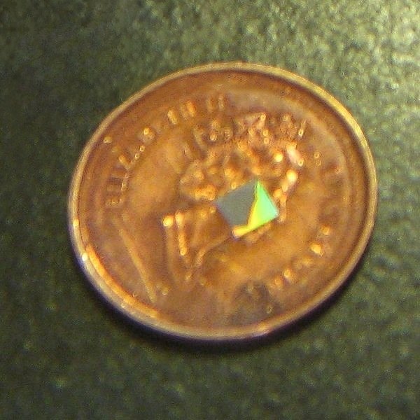 Size comparison of chip compared to a Canadian penny