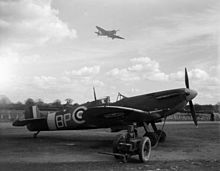 A Supermarine Spitfire at readiness with a trolley accumulator connected Spitfire VB 457 Sqn RAAF at Redhill 1942.jpg