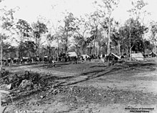 Workers gather at the Cordalba camp site near Maryborough during the Sugar Workers strike of 1911. Workers wanted an eight-hour day and higher wages. Tents appear in the background.