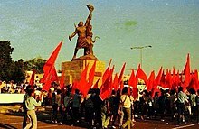 People celebrating the 14th October Revolution next to the Freedom Statue The Freedom Statue.jpg