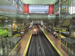 Train emerging from the Center City Commuter Connection at the Market East Station, Philadelphia PA.jpg