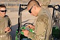U.S. Navy Hospital Corpsman 3rd Class Brian Mays, right, a medic assigned to the Farah Provincial Reconstruction Team (PRT), loads a magazine before completing a rifle qualification range at Forward Operating 130608-N-LR347-007.jpg