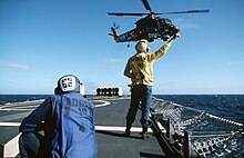 Badger launching a SH-2 Seasprite helicopter during anti-submarine warfare exercises in 1986. USS Badger (FF-1071) SH-2 taking off.jpg