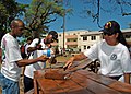 US Navy 060517-N-1161S-019 Sailors assigned to the Nimitz-class aircraft carrier USS George Washington (CVN 73) paint a bench for students at a girls High School during a community relations project in St. John's, Antigua.jpg