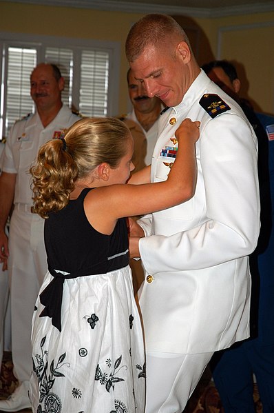 File:US Navy 080829-N-8629D-058 The daughter of Chief Warrant Officer (CWO) 2 Stephen Ditamore pins wings of gold on her father during a winging ceremony at Naval Air Station Corpus Christi.jpg