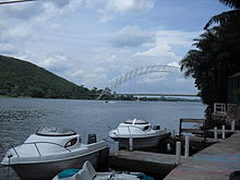 Water taxis on Volta Lake in Ghana Volta River with Adomi Bridge.JPG