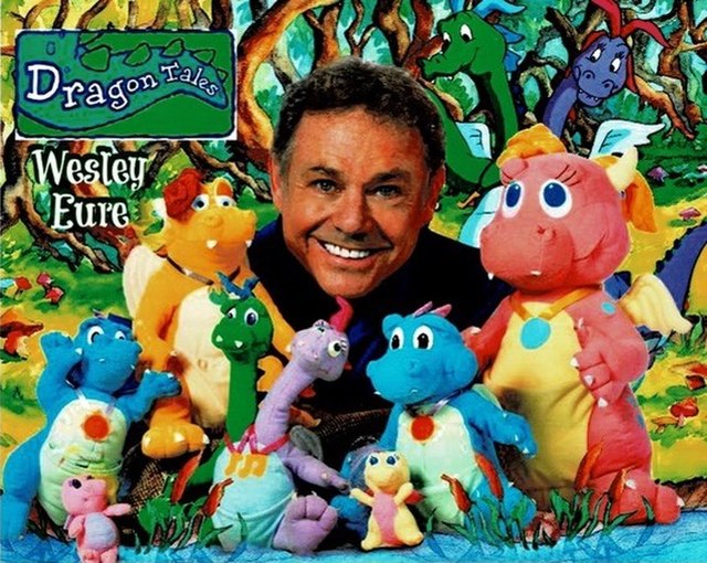 Eure in 2015 with stuffed animals from the show Dragon Tales on PBS that he developed and co-created.