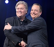 White House Chief Strategist Steve Bannon shakes hands with WH Chief of Staff Reince Priebus at 2017 CPAC