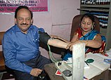 A doctor monitoring the blood pressure of the Union Minister for Health and Family Welfare, Dr. Harsh Vardhan, at the free medical camp.jpg