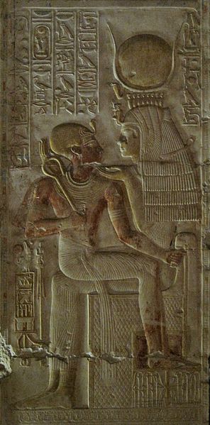 Isis, a mother goddess and a patroness of kingship, holds Pharaoh Seti I in her lap.